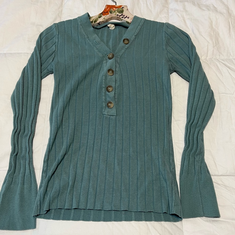 Blue long sleeve with button detail.  Size small.
